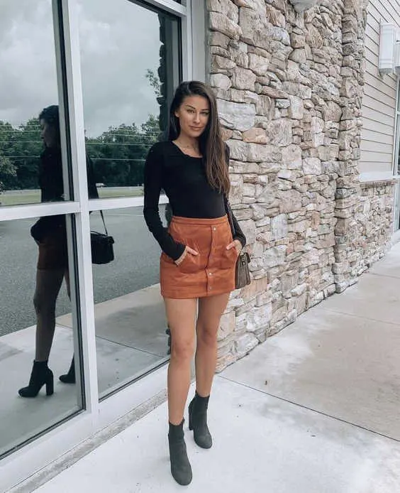 black top and front buttoned mini skirt in suede