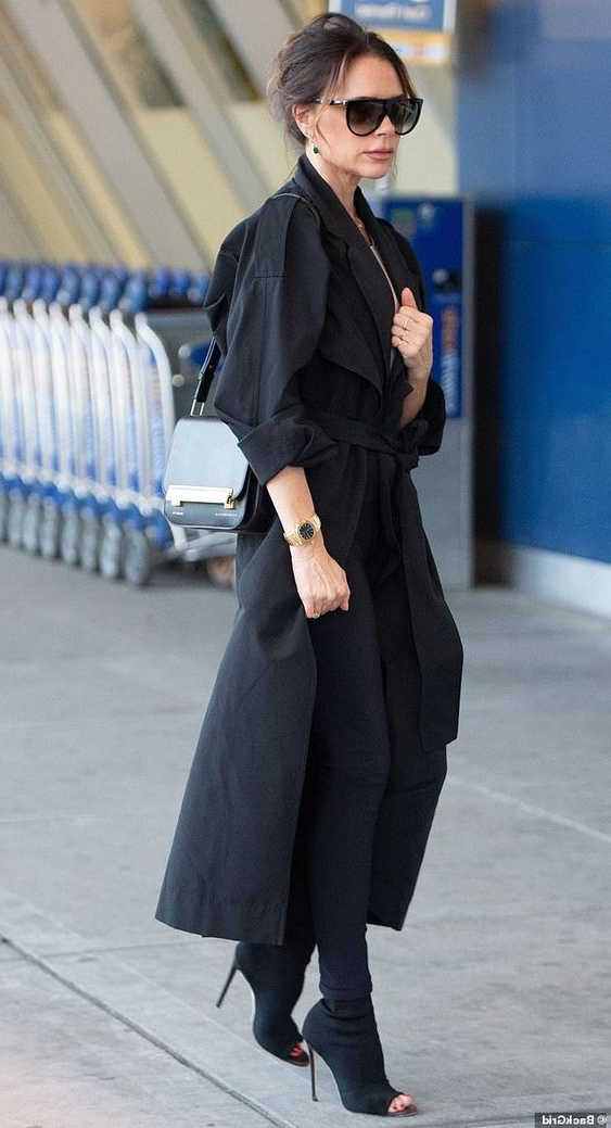 belted black trench coat
